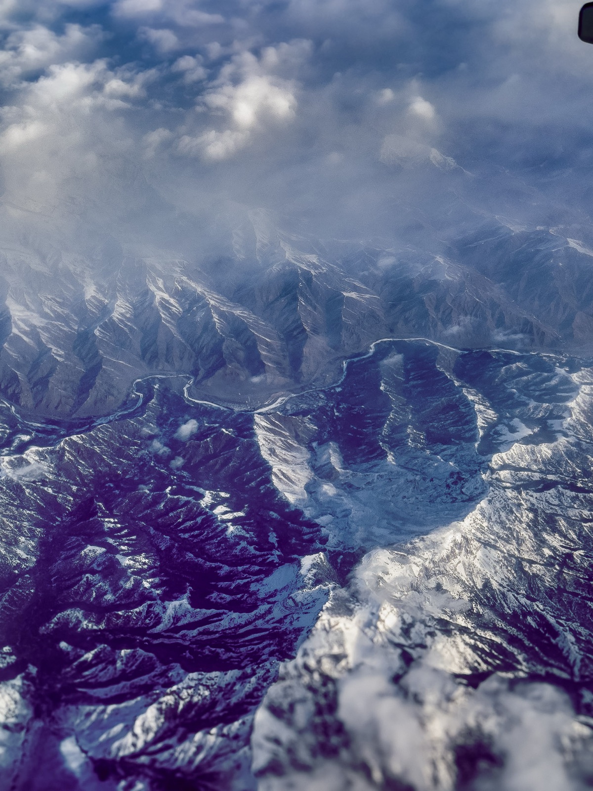 Mountain ridgeline shrouded in mist